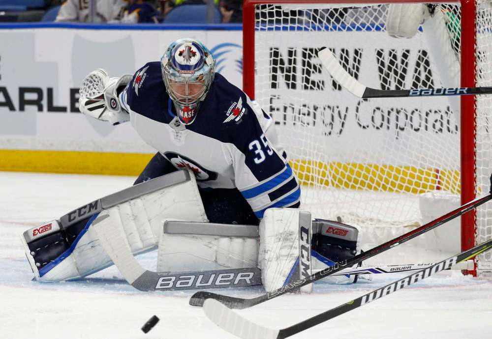 Jeffrey T. Barnes / The Associated Press
Steve Mason is expected to join the Winnipeg Jets Monday in New York after getting a clean bill of health following his second concussion of the season.