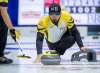 Manitoba skip Reid Carruthers releases a rock as they play Saskatchewan at the Tim Hortons Brier curling championship at the Brandt Centre in Regina on Sunday, March 4, 2018. THE CANADIAN PRESS/Andrew Vaughan