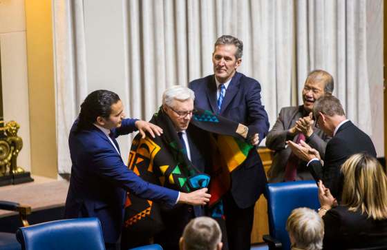 MIKAELA MACKENZIE / WINNIPEG FREE PRESSPremier Brian Pallister and NDP leader Wab Kinew present Greg Selinger with a star blanket on his last day at the Legislature in Winnipeg.