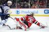 (AP Photo/Julio Cortez)
New Jersey Devils goaltender Cory Schneider (35) dives to deflect the puck out of his crease as Winnipeg Jets left wing Kyle Connor (81) attacks during the first period of an NHL hockey game, Thursday, March 8, 2018, in Newark, N.J.