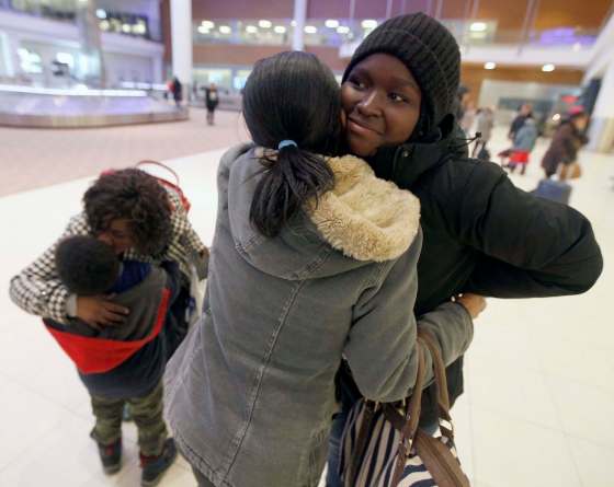 PHIL HOSSACK / WINNIPEG FREE PRESS16-year-old Naomi (right) is welcomed to Winnipeg by her sister Alice Thursday night.