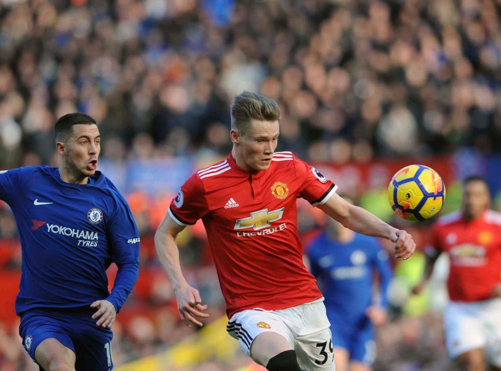 Rui Vieira / The Associated Press files
Manchester United’s Scott McTominay (right, battling for the ball against Chelsea’s Eden Hazard) will have plenty of work to do in today’s match against Liverpool.