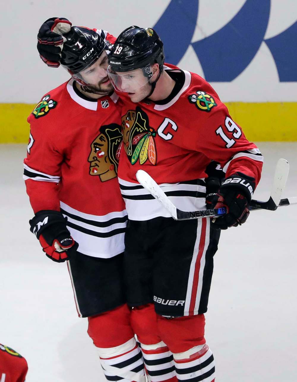 Chicago Blackhawks defenceman Brent Seabrook, left, celebrates with centre Jonathan Toews after scoring his goal against the Boston Bruins during the third period Sunday. (Nam Y. Huh / Associated Press files)