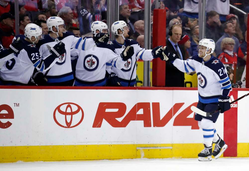 (AP Photo/Alex Brandon)
Winnipeg Jets left wing Nikolaj Ehlers celebrates his goal with his teammates in the first period of an NHL hockey game against the Washington Capitals, Monday, March 12, 2018, in Washington.