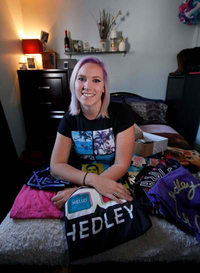 PHIL HOSSACK / WINNIPEG FREE PRESS
Hedley fan Toni-Dawn McGrath poses with some of the band&rsquo;s souvenirs, which she has collected over 11 years of following the group.