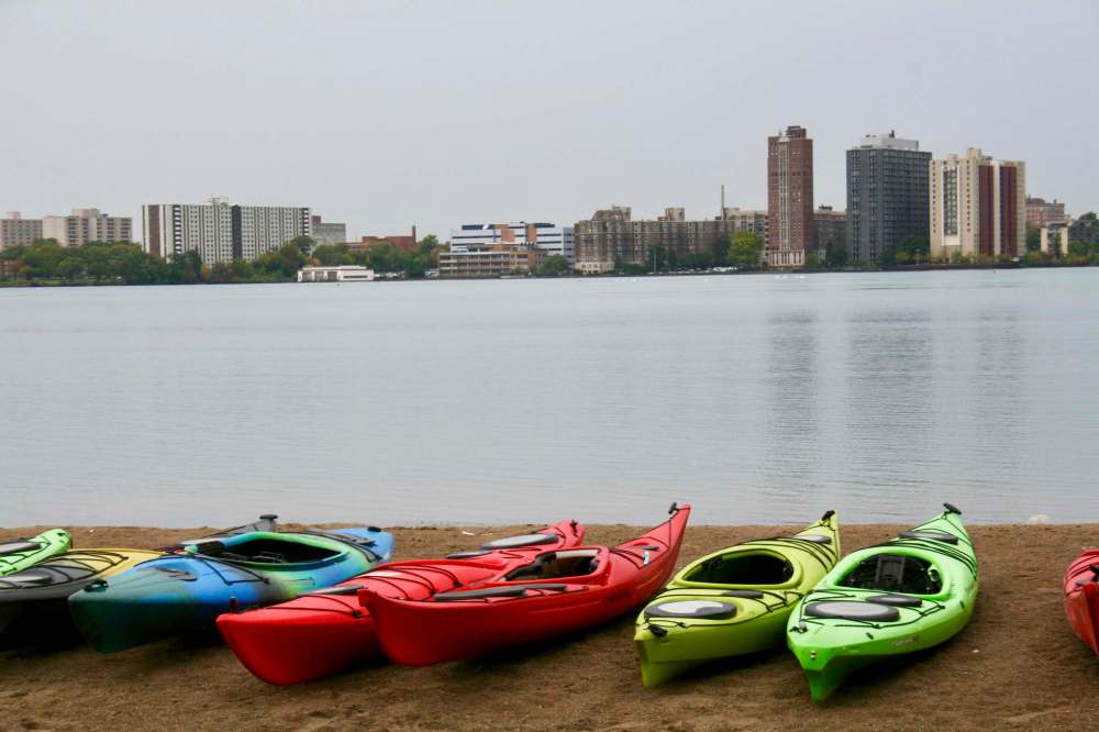 Detroit’s downtown skyline is seen from the sandy shore of Belle Isle Park where kayaking tours down the Detroit River commence.