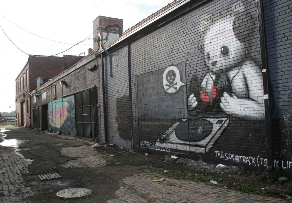 A brick building at Detroit's Eastern Market is tagged with extraordinary graffiti.