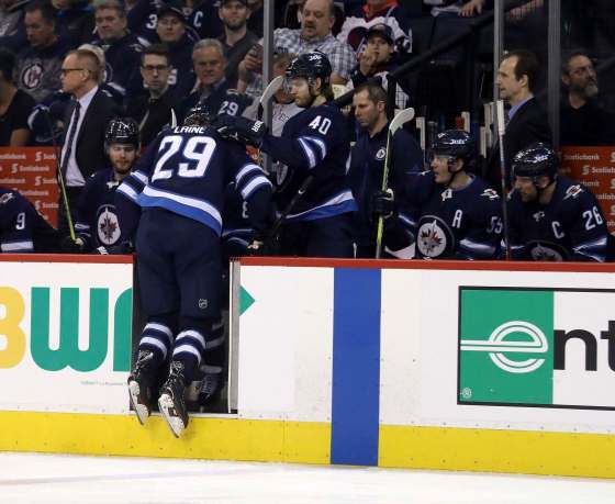 Patrik Laine leaves the ice after getting hurt against the Los Angeles Kings Tuesday night. (Trevor Hagan / The Canadian Press)