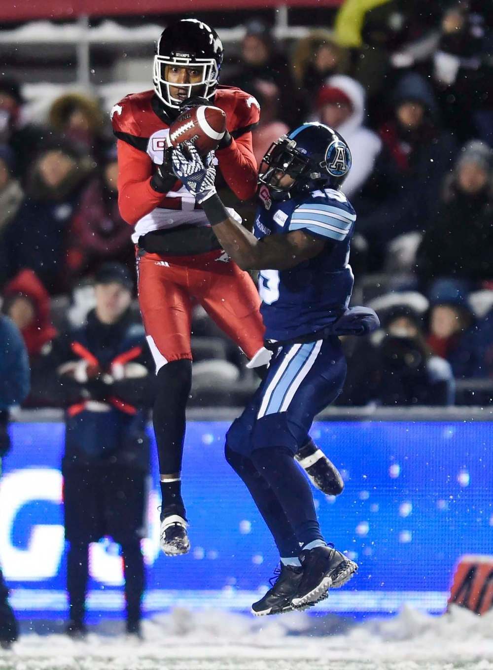 Nathan Denette / The Canadian Press
Argos slotback S.J. Green makes a catch as Stamps defensive back Tommie Campbell defends during second half CFL football action in the 105th Grey Cup n Ottawa.