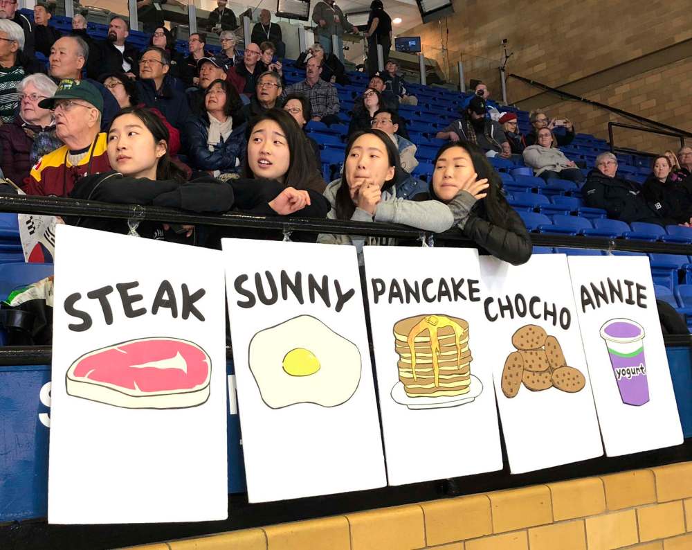 MELISSA MARTIN / WINNIPEG FREE PRESS
Toronto friends, left to right, Isabelle Lee, Harriet Lee, Vanessa Lee and Ashley You watch as Korea’s EunJung Kim battles Swiss skip Binia Feltscher on Thursday afternoon.