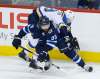 THE CANADIAN PRESS/John Woods
Winnipeg Jets' Mathieu Perreault checks St. Louis Blues' Jay Bouwmeester.