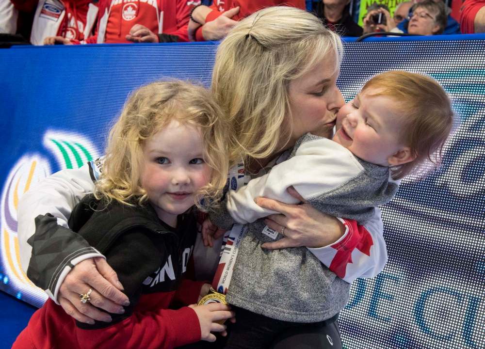 PAUL CHIASSON / THE CANADIAN PRESS
Canada skip Jennifer Jones hugs her children Isabella (left) and Skyla (right) after beating Sweden in the gold medal game at the World Women's Curling Championship Sunday, March 25, 2018 in North Bay, Ont.