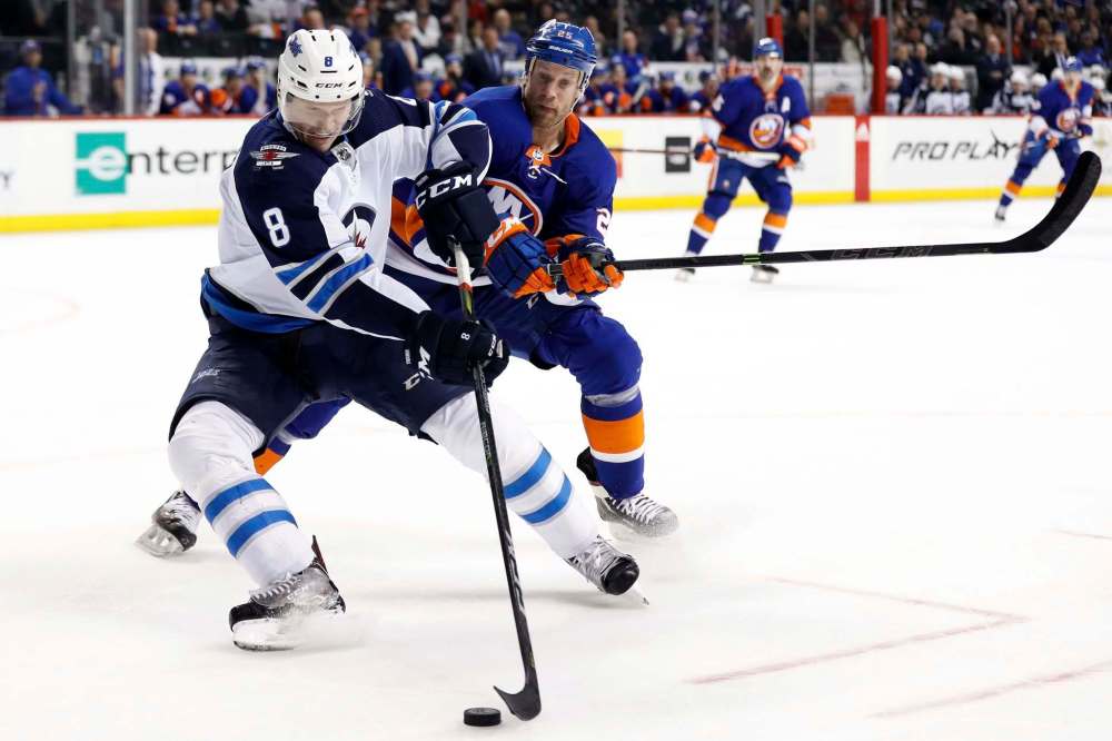 Adam Hunger / The Associated Press files
Winnipeg Jets defenseman Jacob Trouba (left) has been cleared for contact after clearing the NHL's concussion protocol.