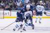 CHRIS YOUNG / THE CANADIAN PRESS
Winnipeg Jets' Tyler Myers (57) brings the puck forward as Toronto Maple Leafs' Connor Brown (28) trails during third period NHL hockey action in Toronto on Saturday, March 31, 2018.