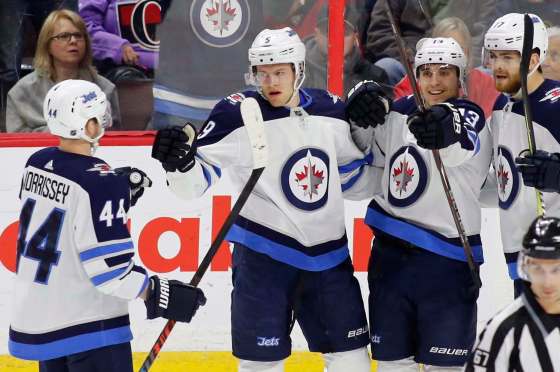 THE CANADIAN PRESS/ Patrick DoyleWinnipeg Jets Andrew Copp (9) celebrates his goal with teammates Josh Morrissey (44), Brandon Tanev (13) and Adam Lowry (17) during first period NHL hockey action against the Ottawa Senators at the Canadian Tire Centre in Ottawa on Monday.