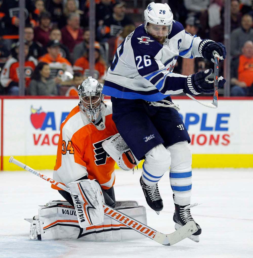 (AP Photo/Tom Mihalek)
Winnipeg Jets' Blake Wheeler in front of Philadelphia Flyers' goalie Petr Mrazek. Wheeler was one of several key players for the Jets that was watching from the press box in Montreal on Tuesday.