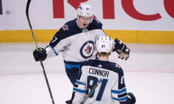 THE CANADIAN PRESS/Paul ChiassonWinnipeg Jets' Tyler Myers congratulates teammate Kyle Connor after Connor scored the winning goal during overtime to beat the Montreal Canadiens 5-4 in NHL hockey action Tuesday in Montreal.