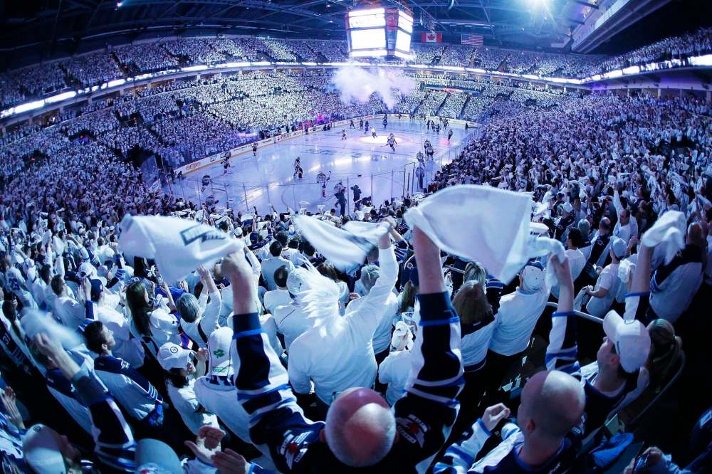 THE CANADIAN PRESS/John Woods
Winnipeg fans celebrate the start the NHL playoffs for the Winnipeg Jets with a whiteout in 2015.