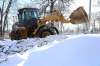 RUTH BONNEVILLE / WINNIPEG FREE PRESS
A loader clears back lanes in the area around Churchill Drive.