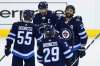 JOHN WOODS / THE CANADIAN PRESS
Winnipeg Jets' Mark Scheifele (55), Blake Wheeler (26), Patrik Laine (29) and Dustin Byfuglien (33) celebrate Byfuglien's goal against the Chicago Blackhawks during first period NHL action in Winnipeg on Saturday, April 7, 2018.
