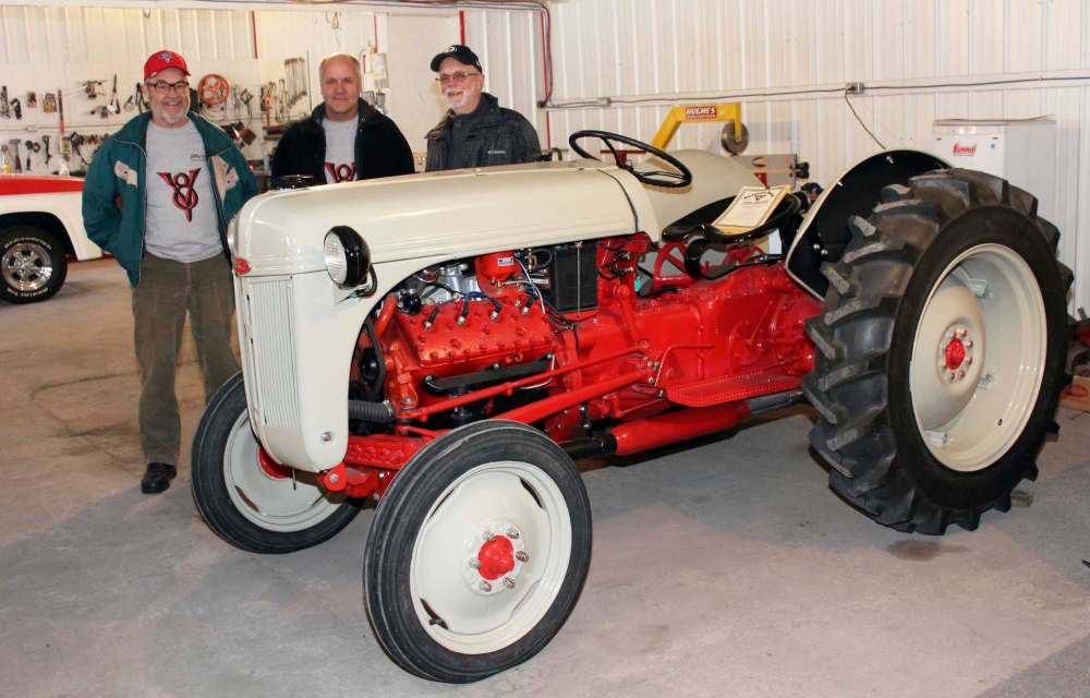 In 2012, Brian Burrows (left) bought this Ford 8N tractor that hadn’t run in years. He enlisted the help of Rick Geisbrecht (centre) and Al Holmberg to find the parts and put in the elbow grease to get it working again. (Photos by Larry D'Argis / Winnipeg Free Press)