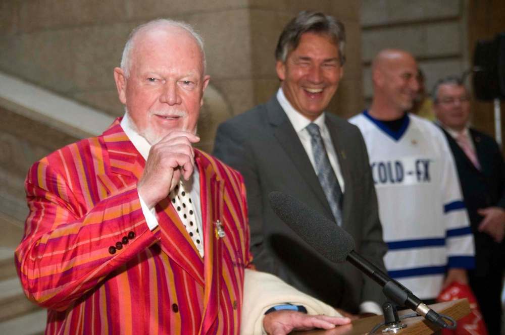 THE CANADIAN PRESS FILES
Don Cherry, left, speaks at the Manitoba legislature with Premier Gary Doer, centre, in 2009 to celebrate Canada's Olympic and Paralympic athletes in Manitoba.