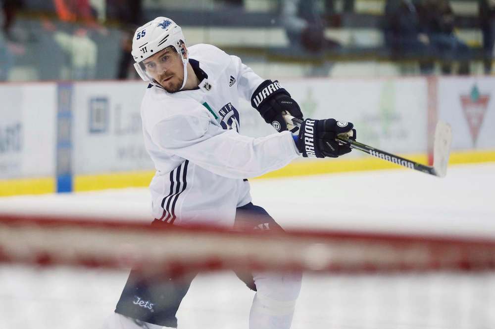 Winnipeg Jets' Mark Scheifele (55) takes a shot during a round one playoff practice in Winnipeg on Monday, April 9, 2018. THE CANADIAN PRESS/John Woods