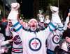 THE CANADIAN PRESS/ Mike Sudoma
Winnipeg Jets fans celebrate a win over the Minnesota Wild in game one of their NHL playoff series, Wednesday.