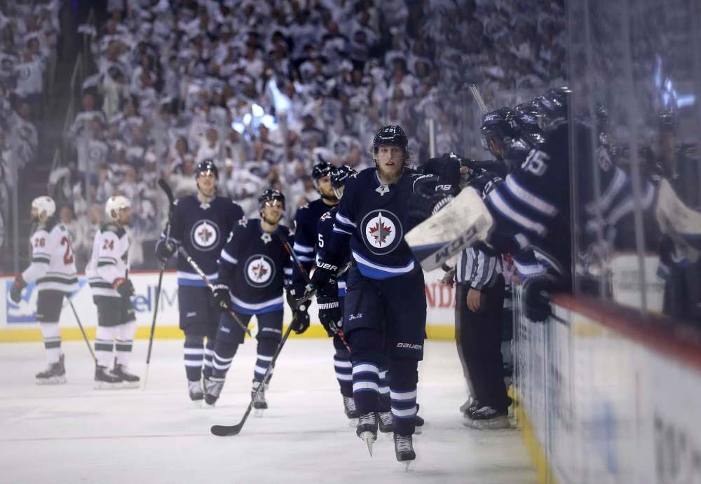 TREVOR HAGAN / WINNIPEG FREE PRESS
Winnipeg Jets' Patrik Laine (29) celebrates after scoring on Minnesota Wild's goaltender Devan Dubnyk (40) during third period NHL playoff action, Wednesday, April 11, 2018.
