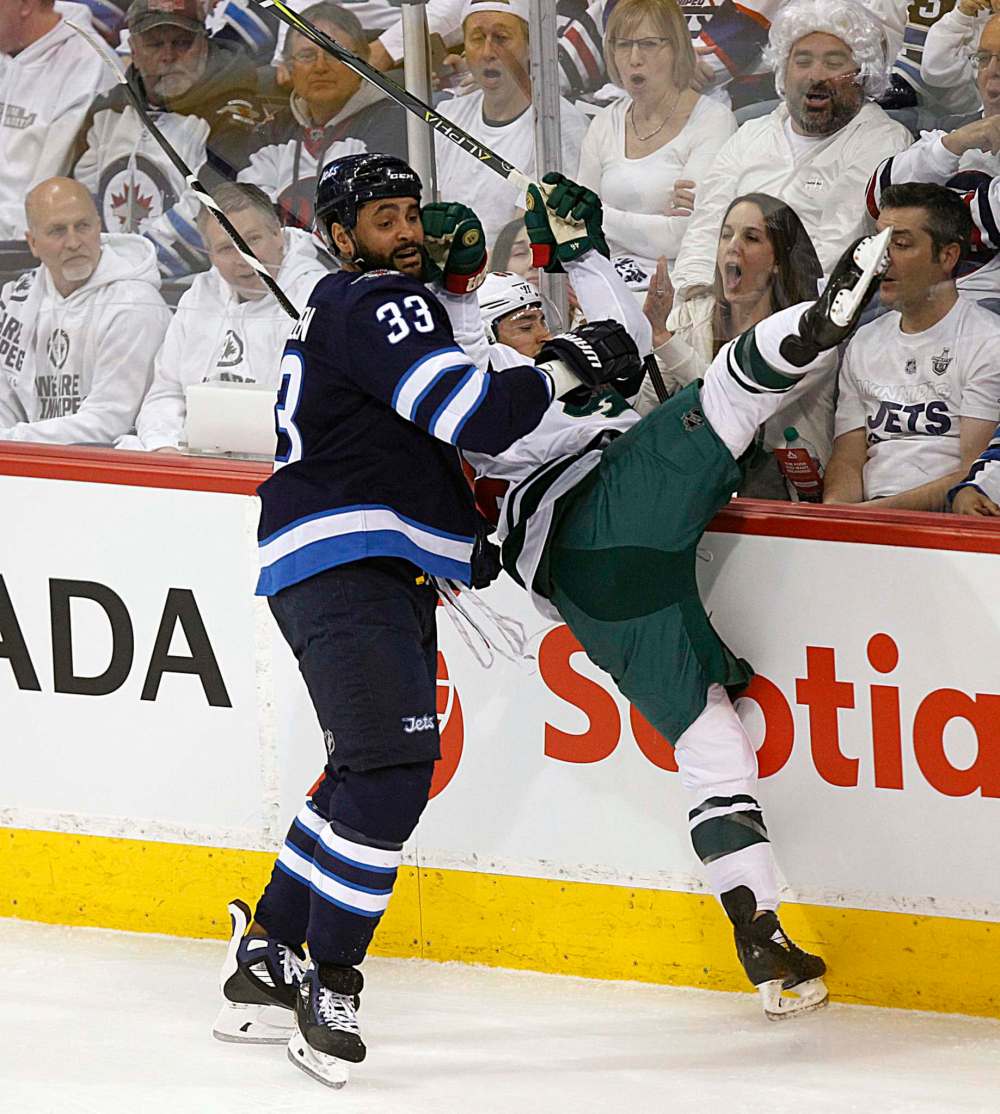 PHIL HOSSACK / WINNIPEG FREE PRESS
Winnipeg Jets' Dustin Byfuglien takes out Minnesota Wild's Jared Spurgeon Wednesday.