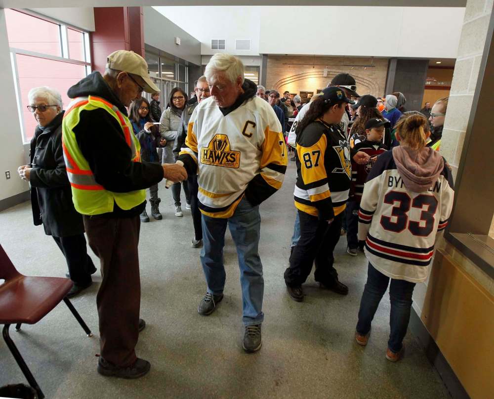 MJHL fans present their tickets to a sold out playoff match with the Virden Oil Capitals and the Steinbach Pistons at the Virden Tundra Oil Gas Place Thursday. (Phil Hossack / Winnipeg Free Press)