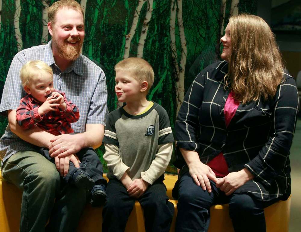 Aren (left) and Holly Marie (right) with two of their five children. Besides having parents who have lived through the experience visiting the unit, the revived program will also include parent group sessions and peer-to-peer support sessions. (Boris Minkevich / Winnipeg Free Press)