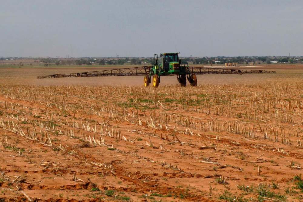 (AP Photo/Betsy Blaney)
A cotton farmer works his fields north of Lubbock, Texas. People behind the new Climate Atlas of Canada estimate that Manitoba's climate could be like that of northern Texas by the year 2080.