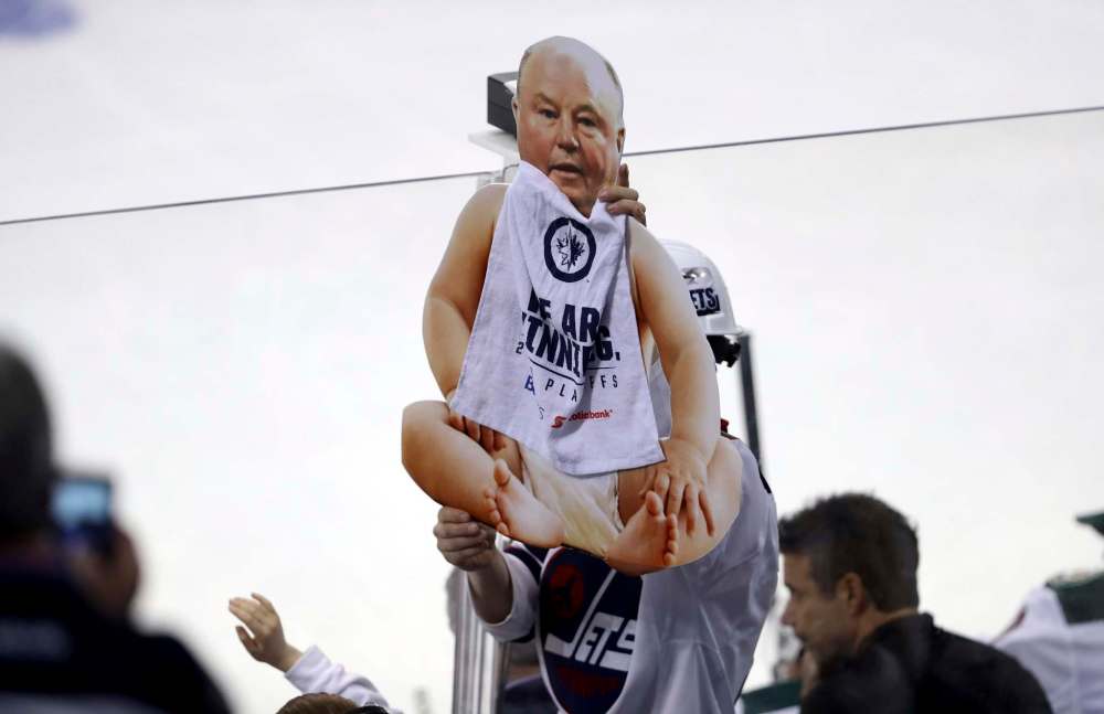 TREVOR HAGAN / WINNIPEG FREE PRESS A Winnipeg Jets' fan holds a sign depicting Minnesota Wild's head coach Bruce Boudreau during game 5 in the playoffs, Friday, April 20, 2018.