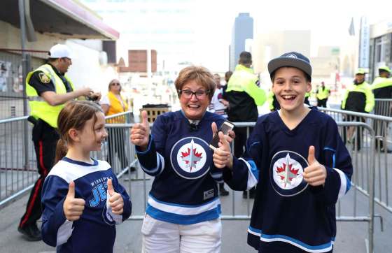 RUTH BONNEVILLE / WINNIPEG FREE PRESSAlice Bourgouin and her two grandchildren Brady, 12, and Hannah, 9, can't hold back their excitement when they were allowed in to the Whiteout street party for Game 1 of the Western Conference final between the Jets and the Las Vegas Golden Knights.