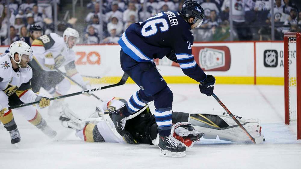 JOHN WOODS / THE CANADIAN PRESS
Jets captain Blake Wheeler beats Vegas Golden Knights goaltender Marc-André Fleury, but his shot misses the open net during Saturday’s game in Winnipeg. No matter — the Jets got four goals in a Game 1 victory.