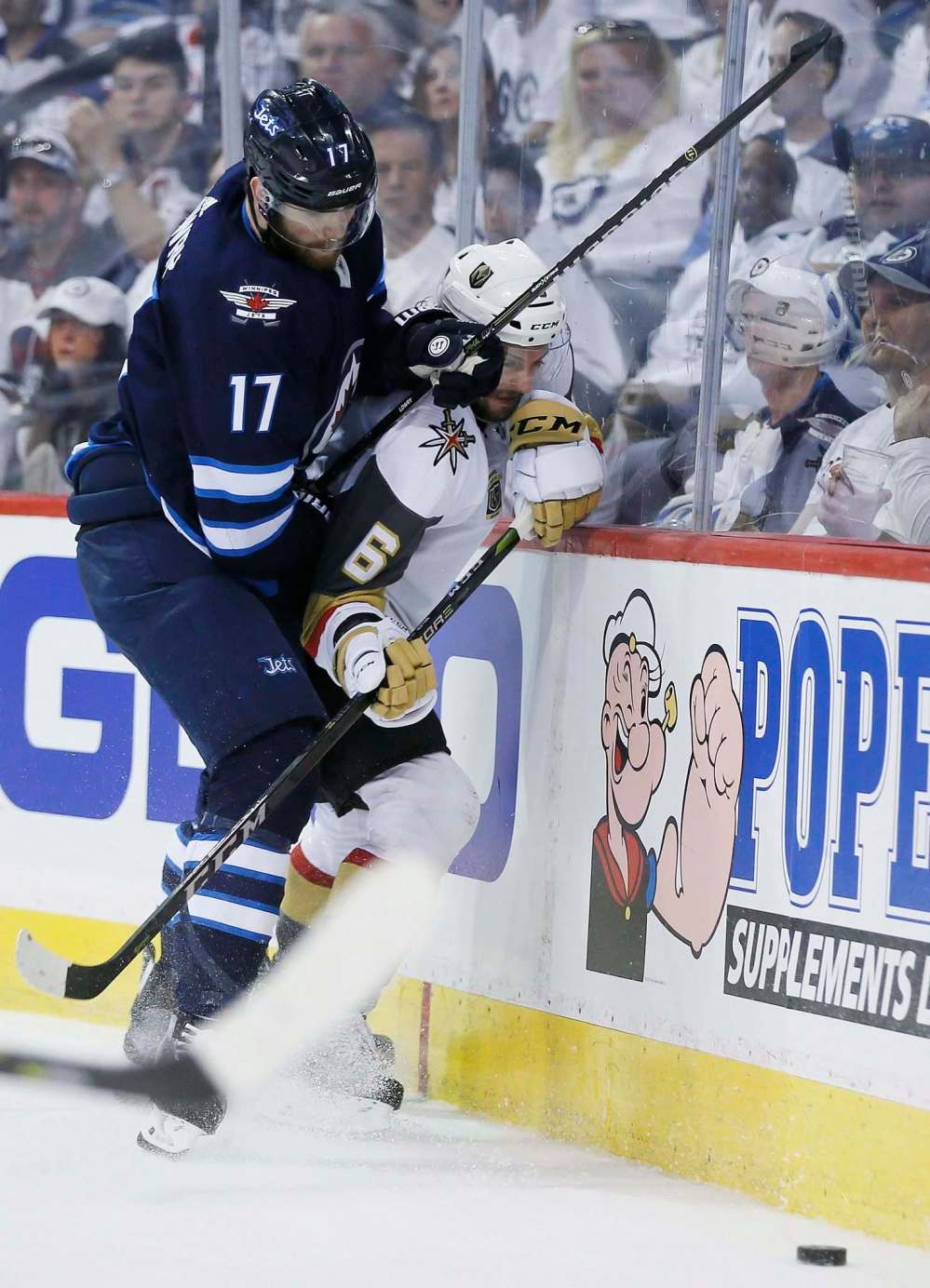 JOHN WOODS / THE CANADIAN PRESS
Winnipeg Jets' Adam Lowry (17) checks Vegas Golden Knights' Colin Miller (6) during second period of game one action in the NHL Western Conference Final in Winnipeg on Saturday, May 12, 2018.