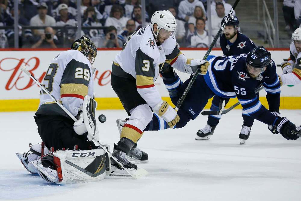 JOHN WOODS/ WINNIPEG FREE PRESS
Winnipeg Jets' Mark Scheifele attempts to tip the shot from the point against Vegas Golden Knights goaltender Marc-Andre Fleury and Brayden McNabb during the second period, Monday.