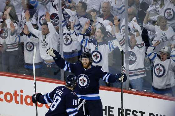 JOHN WOODS / WINNIPEG FREE PRESSWinnipeg Jets' Kyle Connor and Bryan Little celebrate Connor's goal on Vegas Golden Knights during third period of Game 2 on Monday.