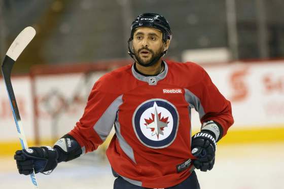 JOE BRYKSA / WINNIPEG FREE PRESS FILESDustin Byfuglien will miss Sunday nights's game against the Vancouver Canucks at the MTS Centre.