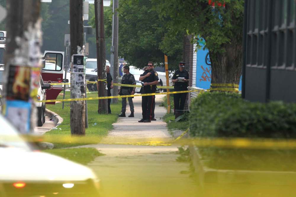 Police investigate bombing that took place at Petersen and King Law Office at 252 River Avenue in July 2015. (Ruth Bonneville / Winnipeg Free Press files)