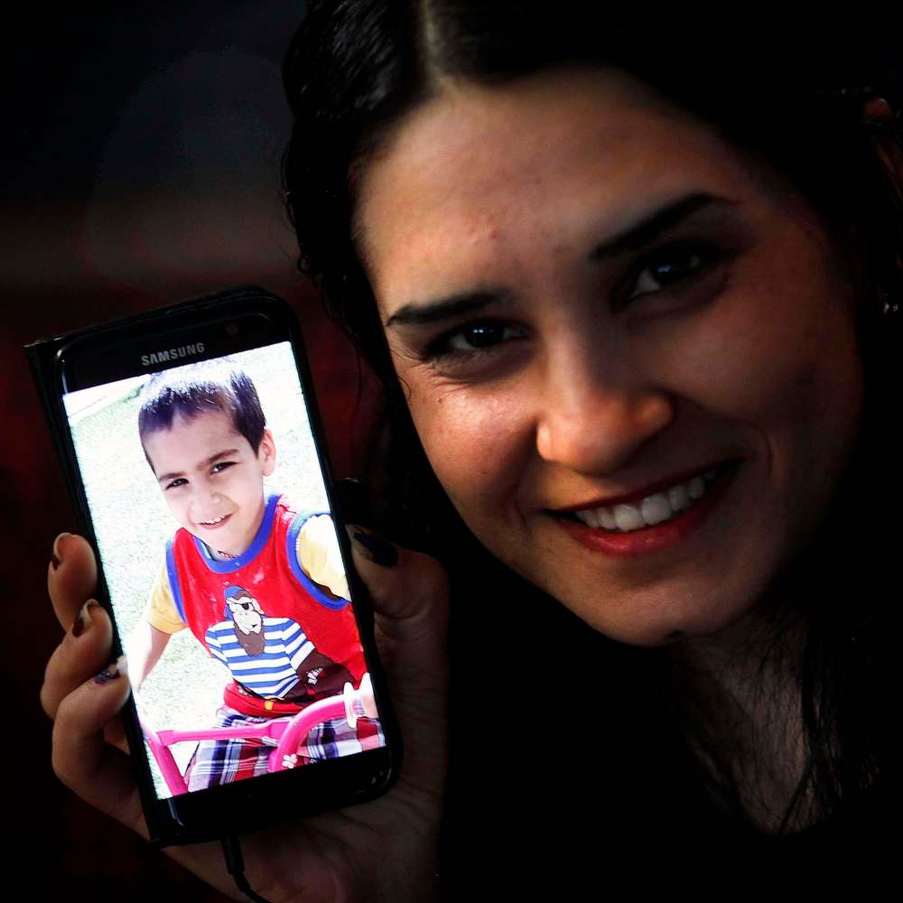 PHIL HOSSACK / WINNIPEG FREE PRESS
Not quick to smile, Mejo happily describes her young son Harman.