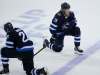 JOHN WOODS/ WINNIPEG FREE PRESS
Blake Wheeler (left) and Patrik Laine after the final whistle Sunday.