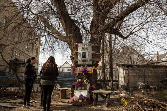 MIKE DEAL / WINNIPEG FREE PRESS FILESFriends and family gather around a makeshift memorial for Simone Sanderson in the vacant lot where her body was found in April, 2016.