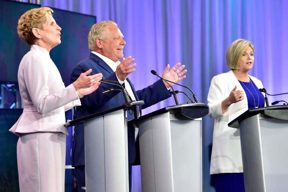 Frank Gunn
/ The Canadian Press
Ontario Liberal Leader Kathleen Wynne, left to right, Ontario Progressive Conservative Leader Doug Ford and Ontario NDP Leader Andrea Horwath participate during the third and final televised debate of the provincial election campaign in Toronto, Sunday, May 27, 2018.
