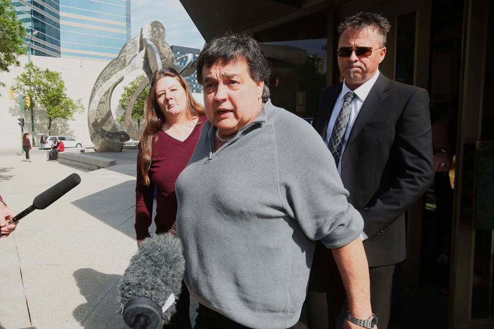 JOHN WOODS / WINNIPEG FREE PRESSFrank Ostrowski leaves the Law Courts after a day of testimony Monday. The Crown has conceded his 1987 murder conviction cannot stand in the wake of new evidence suggesting the evidence against him was tainted.