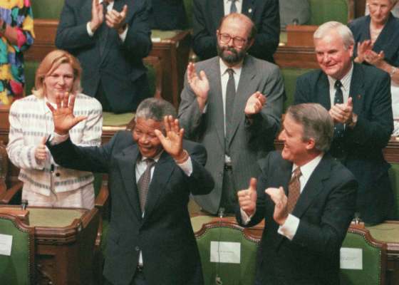Fred Chartrand / The Canadian Press filesFormer prime minister Brian Mulroney (front right) applauds South African anti-apartheid activist Nelson Mandela in the House of Commons on June 18, 1990.