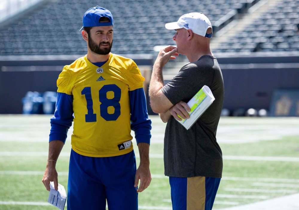 ANDREW RYAN / WINNIPEG FREE PRESS
Blue Bombers quarterback Alex Ross speaks to Offensive Coordinator & Receivers coach Paul LaPolice.
