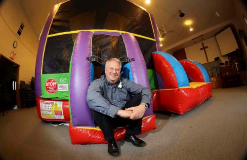 TREVOR HAGAN / WINNIPEG FREE PRESS
Pastor Rod Giesbrecht of Tabor Baptist Church spends much of his weekends setting up and taking down inflatables for various events.