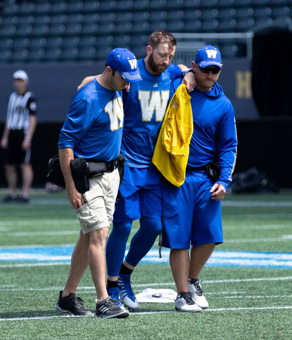 ANDREW RYAN / WINNIPEG FREE PRESS
Winnipeg Blue Bombers Quarterback Matt Nichols comes off of the field after an injury during practice on Wednesday.